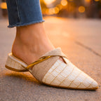 Close-up of croc embossed texture and gold-tone bar detail