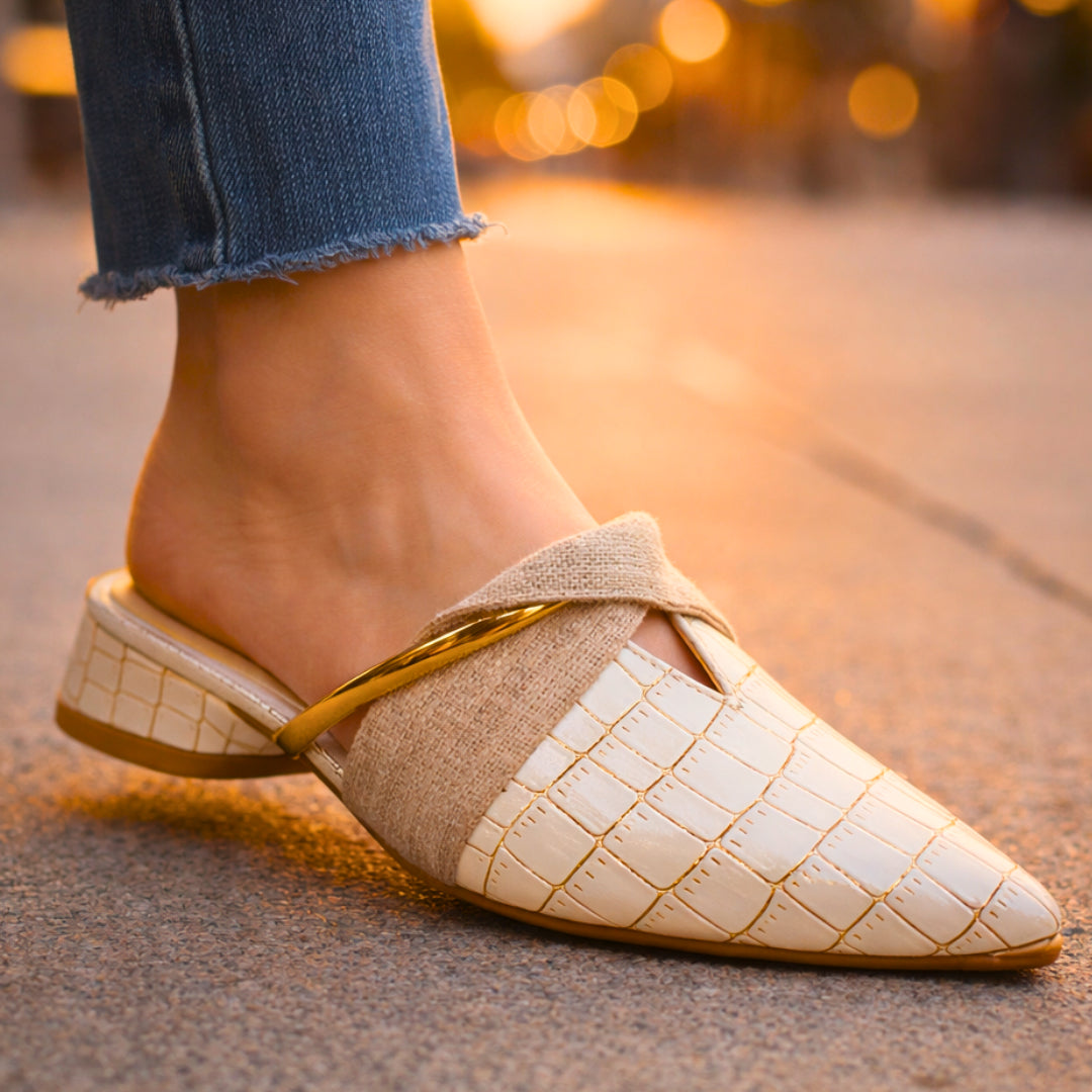 Close-up of croc embossed texture and gold-tone bar detail