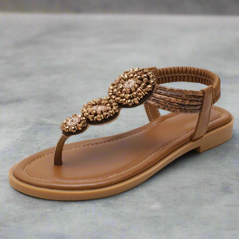 Overhead view of embellished toe post sandal showing beaded pattern