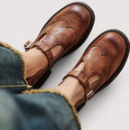 Women's leather brogue Mary Jane sandals with buckle strap, front view