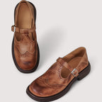 Side profile of leather brogue sandal showing T-bar and chunky sole