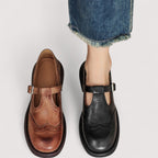 Top-down view of leather brogue sandal showing sole and strap