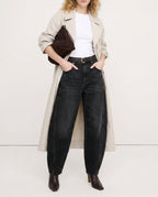 Side profile of leopard print jeans showcasing barrel leg silhouette