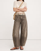 Ankle opening of leopard jeans showing barrel leg break