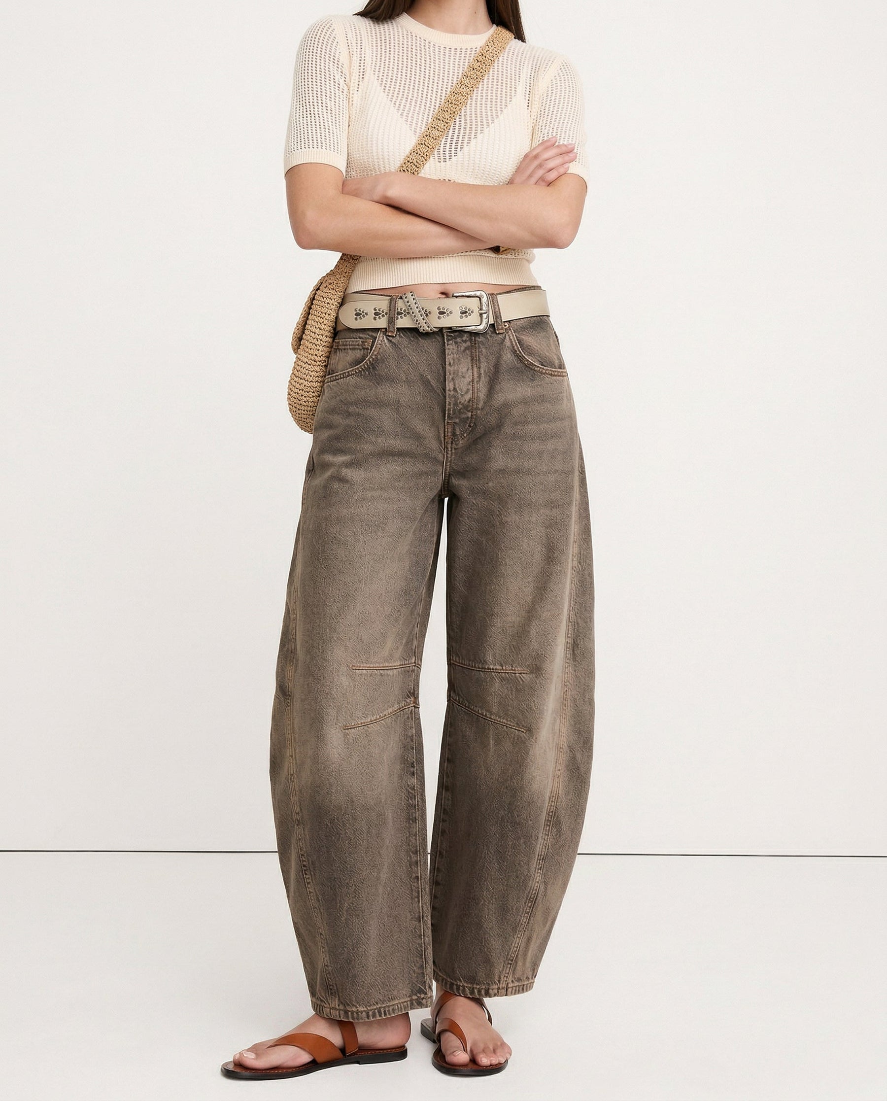 Ankle opening of leopard jeans showing barrel leg break