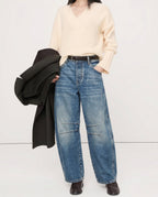 Waistband and zipper detail of leopard denim jeans