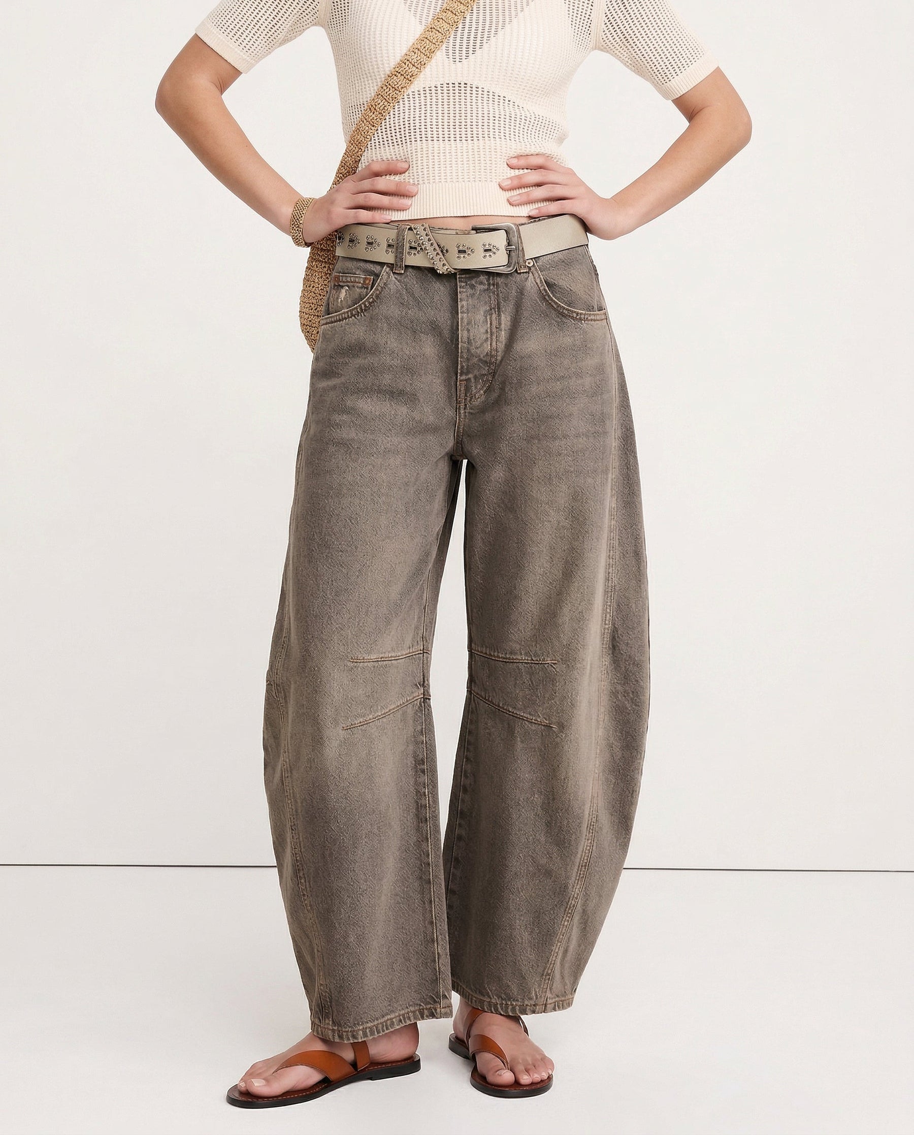 Woman posing from behind in leopard wide leg jeans