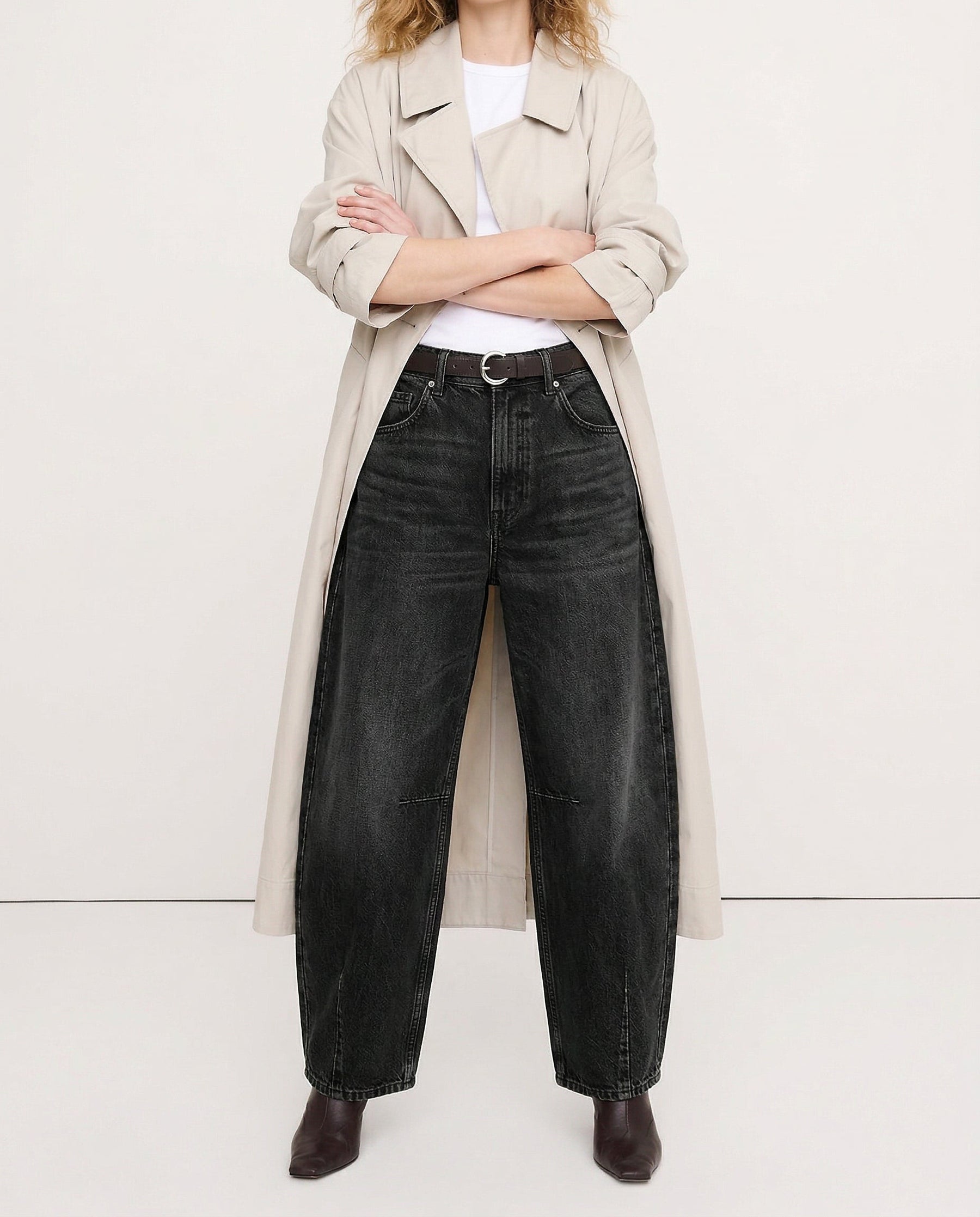 Leopard denim jeans paired with white sneakers, full length view