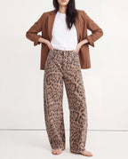 Women wearing leopard print wide leg denim jeans, front view