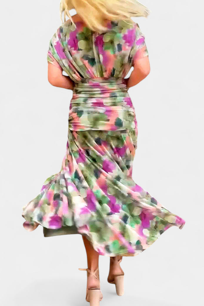 Model seated showing dress movement and drape