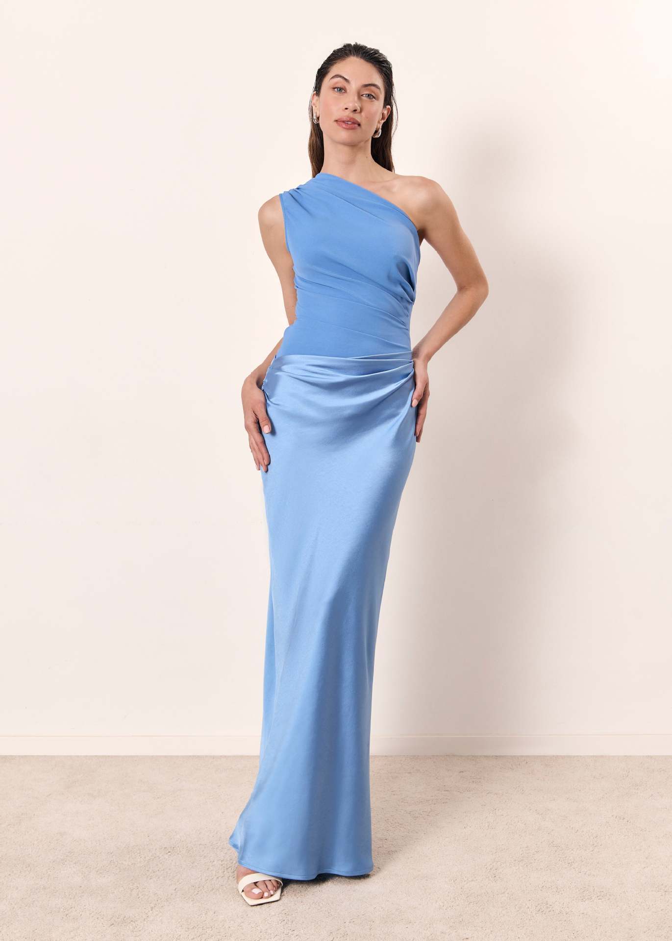 Close-up of ruched detailing on one-shoulder neckline