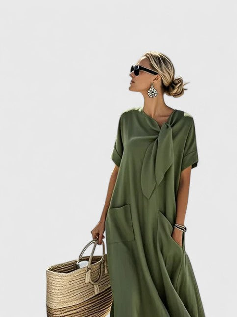 Rear view of brown tie neck maxi dress on model