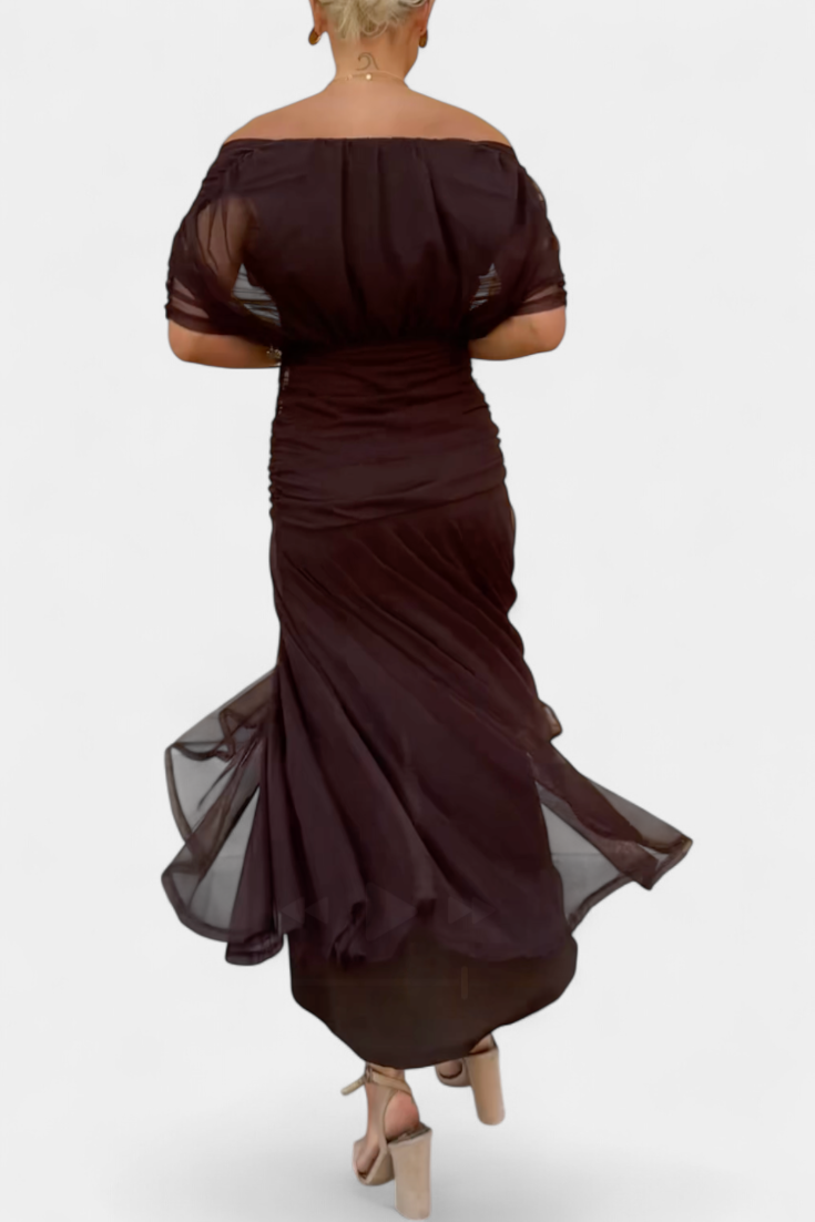 Model in off-shoulder maxi dress, back view