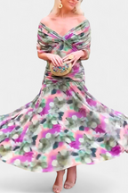 Model posing in ruched maxi dress, three-quarter angle