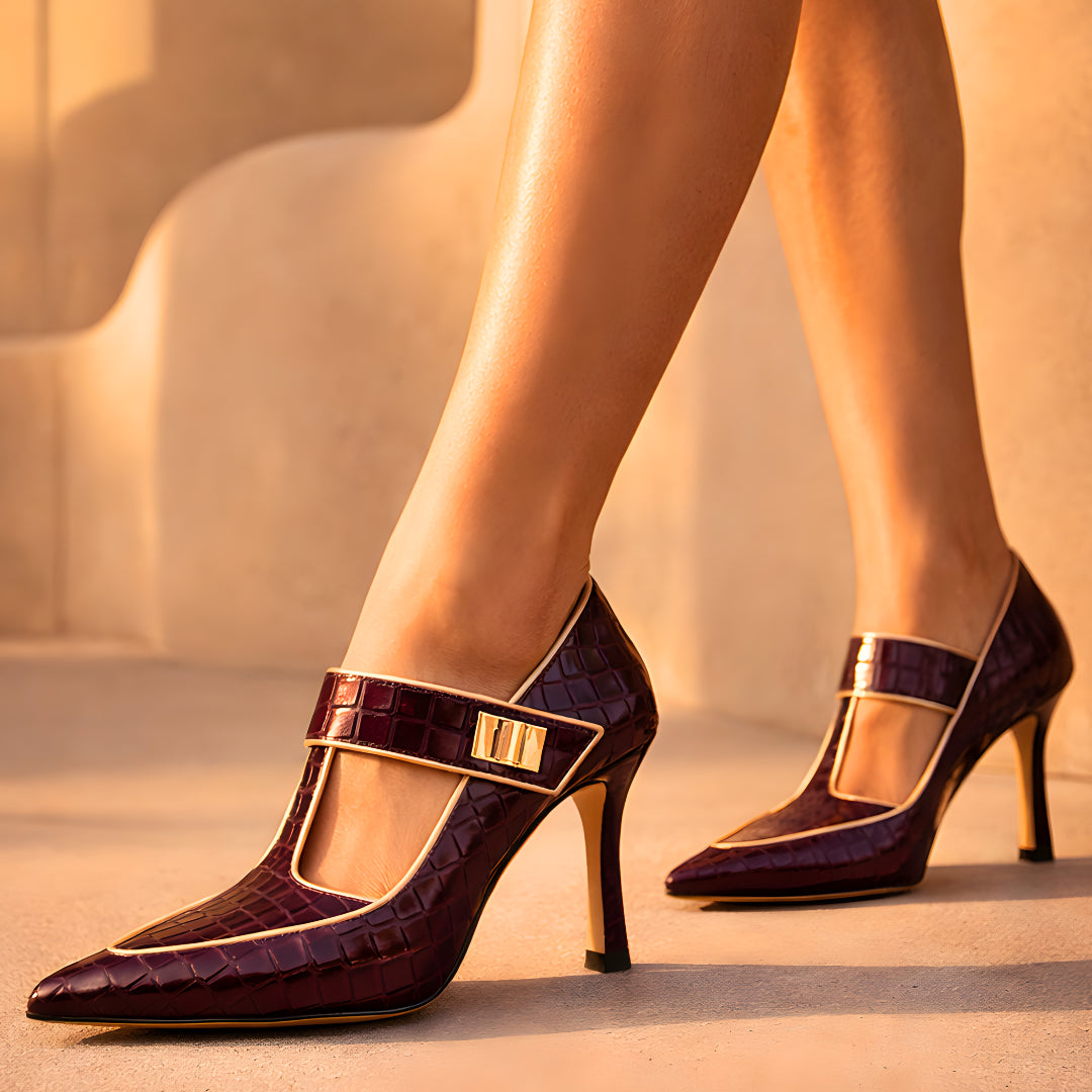 Woman's leg wearing burgundy croc heel, side angle
