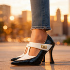 Seated pose wearing burgundy croc-embossed heels