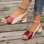 Woman wearing burgundy croc slingback sandals, standing pose