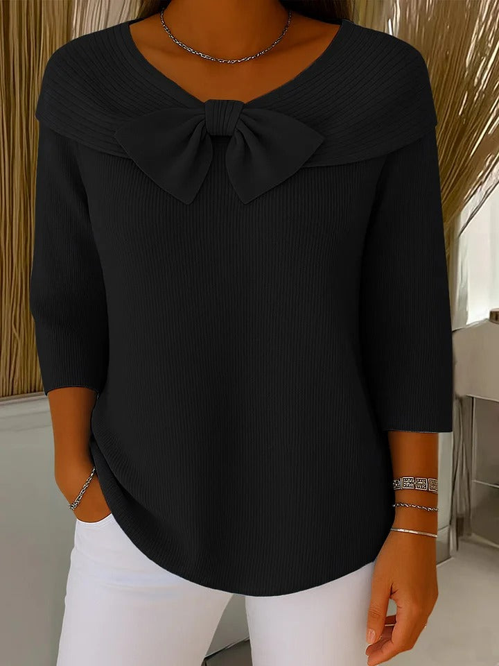 Detail shot of fold-over collar and bow drape from front