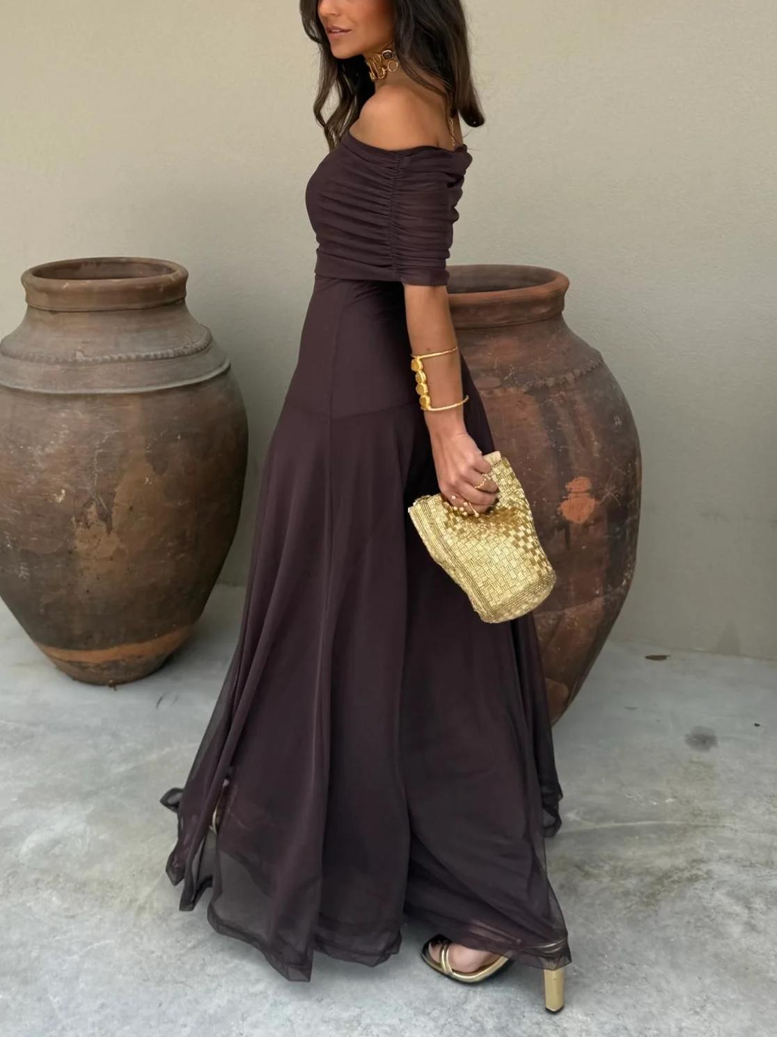 Model wearing off-shoulder maxi dress, full-length standing pose