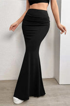 Back view of high-waisted maxi skirt with ruched texture