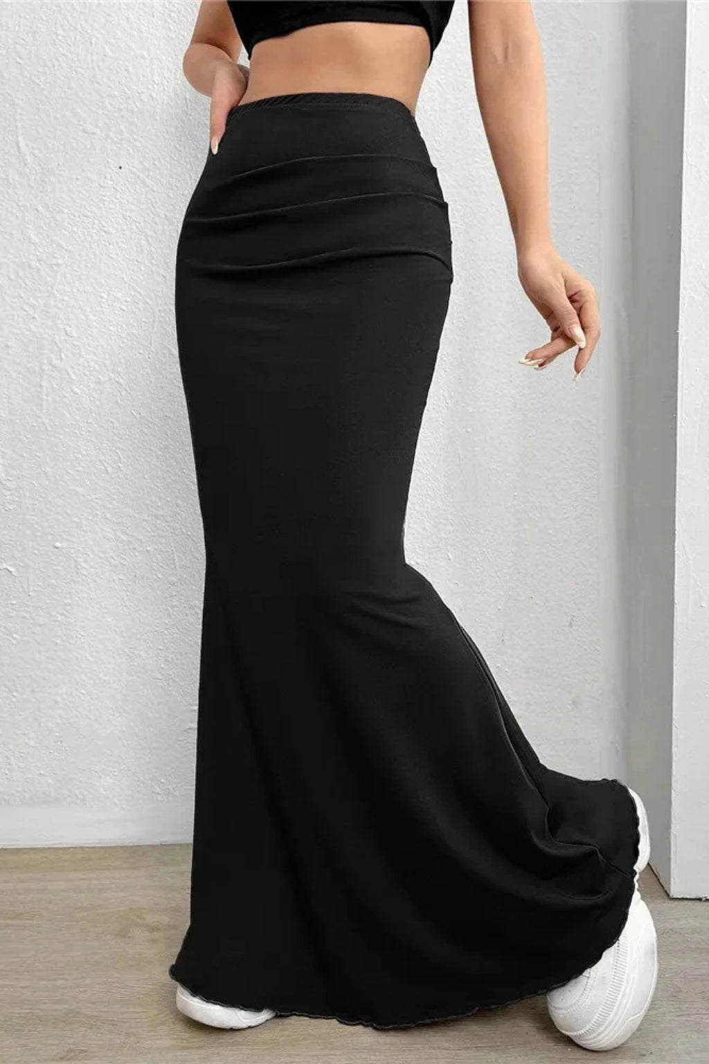 Model wearing mermaid skirt, standing full length