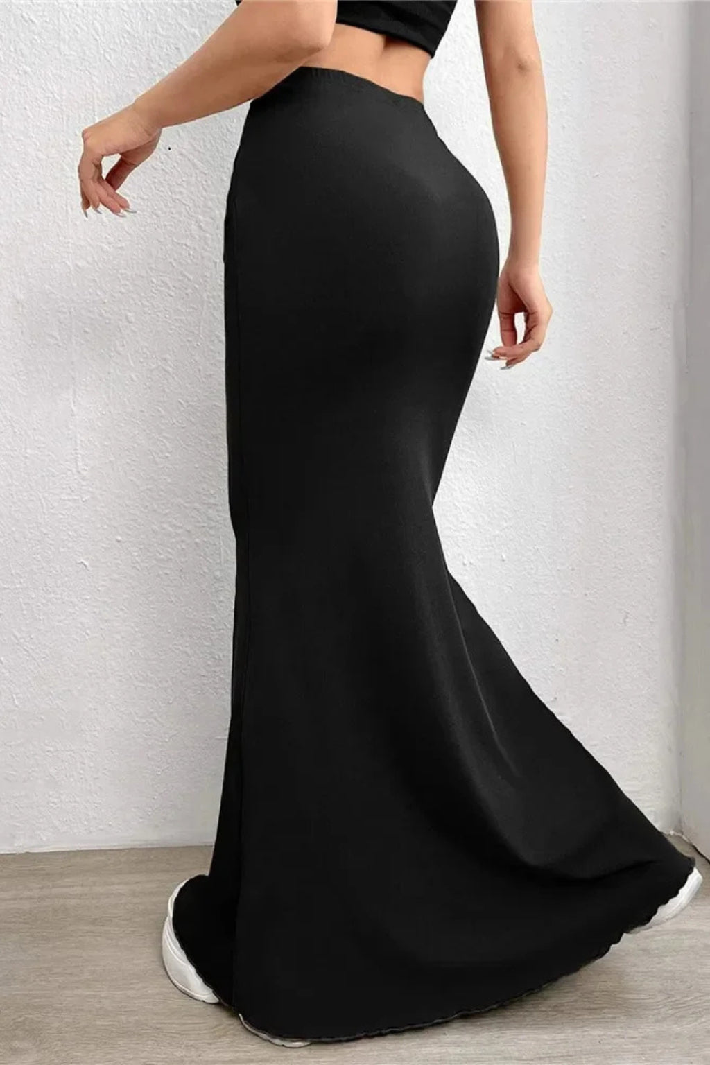 Mermaid skirt worn with styled top, full-body pose
