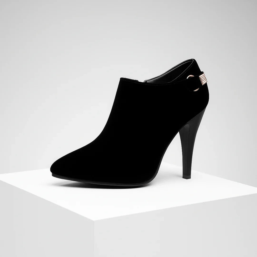 Woman wearing boots, walking pose showing heel and silhouette