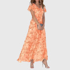 Women's coral floral maxi dress with v-neckline and flutter sleeves, front view