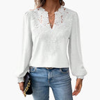 Full-length view of model wearing lace trim V-neck blouse