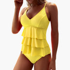 Model wearing tiered ruffle tankini, full-length standing pose