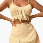 Women's broderie anglaise bikini set with ruffle top and swim skirt, front view