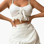 Model wearing ruffle bikini top with adjustable straps and high-waisted bottoms