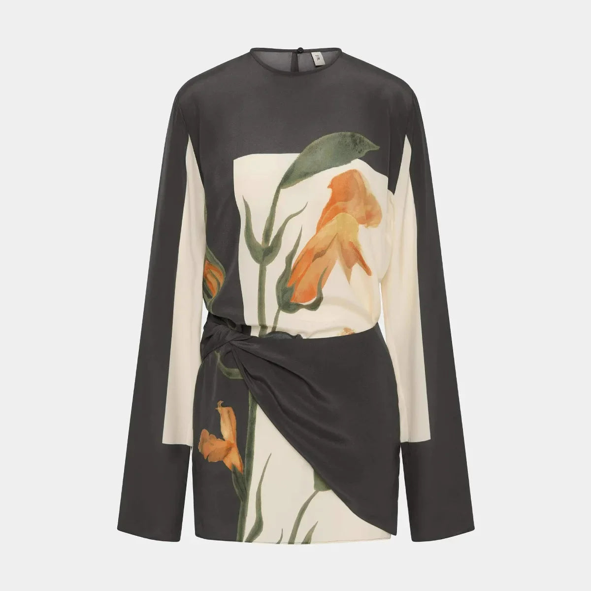 Close-up of draped overlay and floral print texture on dress waist