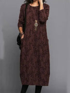 Long sleeve detail and neckline of floral jacquard dress