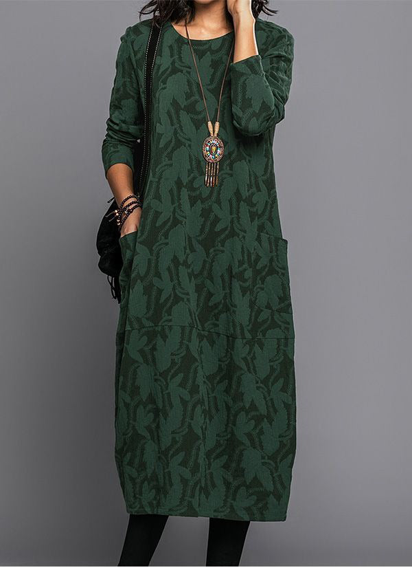 Model wearing floral maxi dress, full-length standing pose