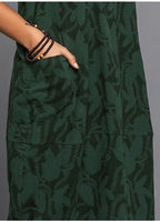 Close-up of tonal floral jacquard pattern on maxi dress fabric