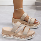Woman wearing gold flatform sandal, full leg view
