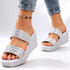 Top-down view of metallic sandal showing strap placement