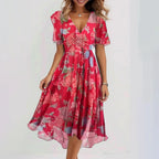 Rear view of dress showing wrap back and flutter sleeve detail