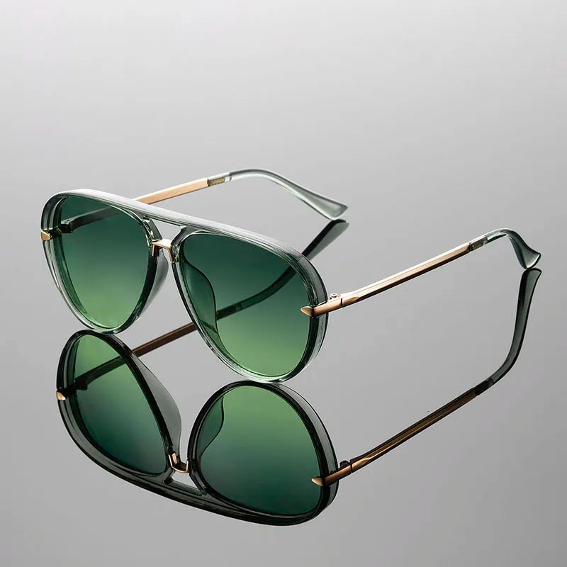 Women's aviator sunglasses with gradient green lenses and polished gold metal arms