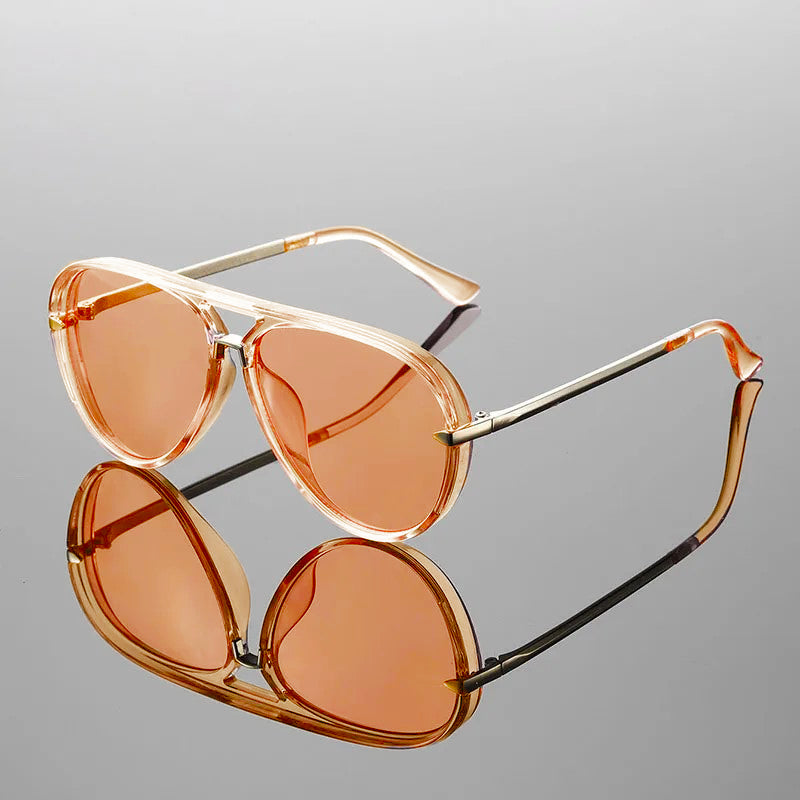 Side profile view of aviator sunglasses on model