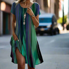 Model posing in striped midi dress showing side drape and hemline detail