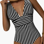 Rear view of striped one piece swimsuit showing back coverage