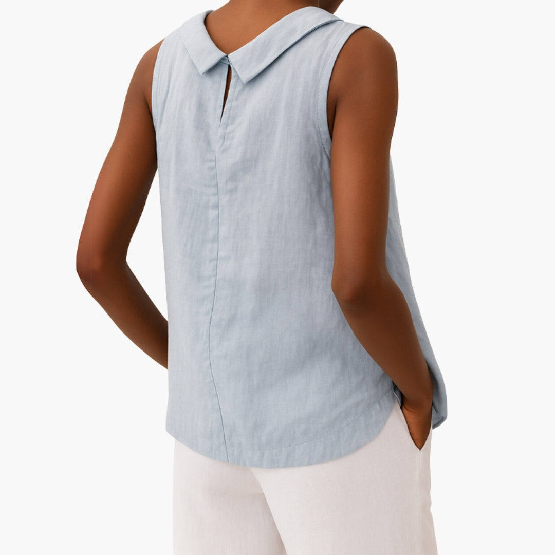 Model in sleeveless top, side profile showing curved hem