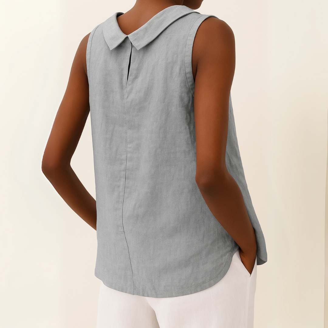 Model wearing sleeveless roll collar top, standing pose