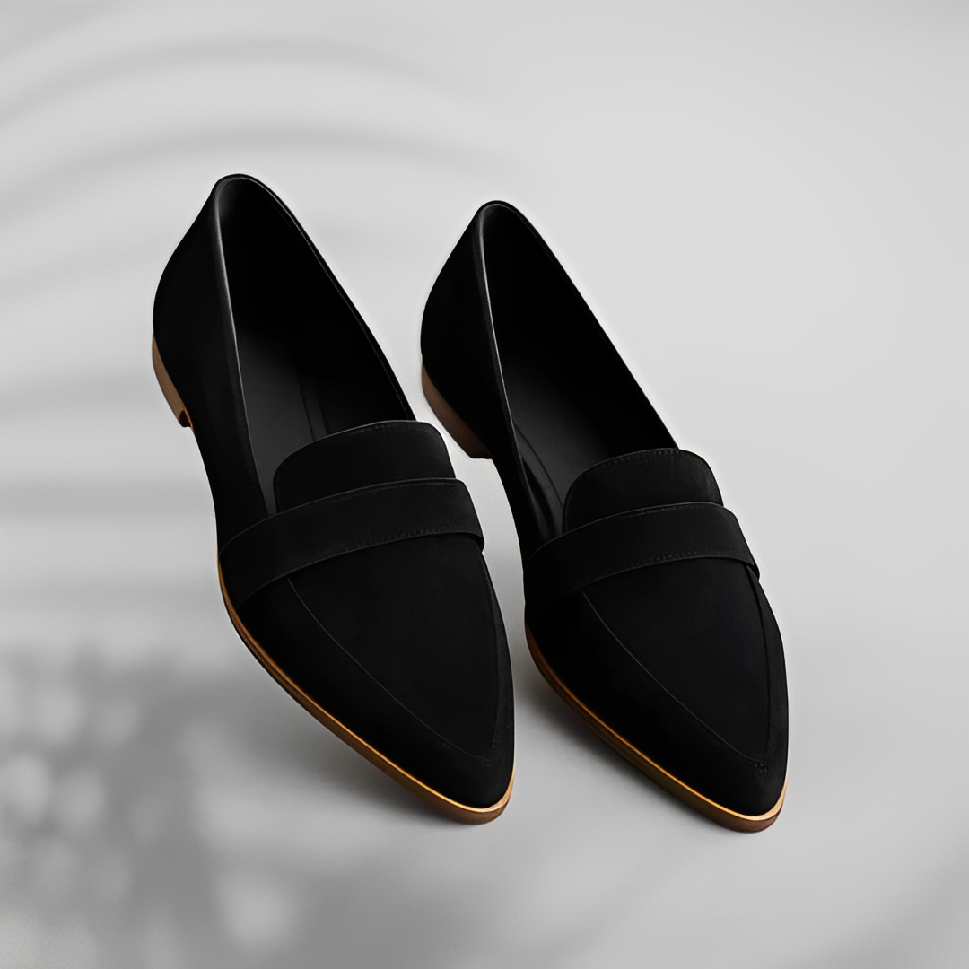 Grey suede loafer worn with casual dress, overhead angle