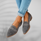 Grey suede pointed toe loafer displayed on white background