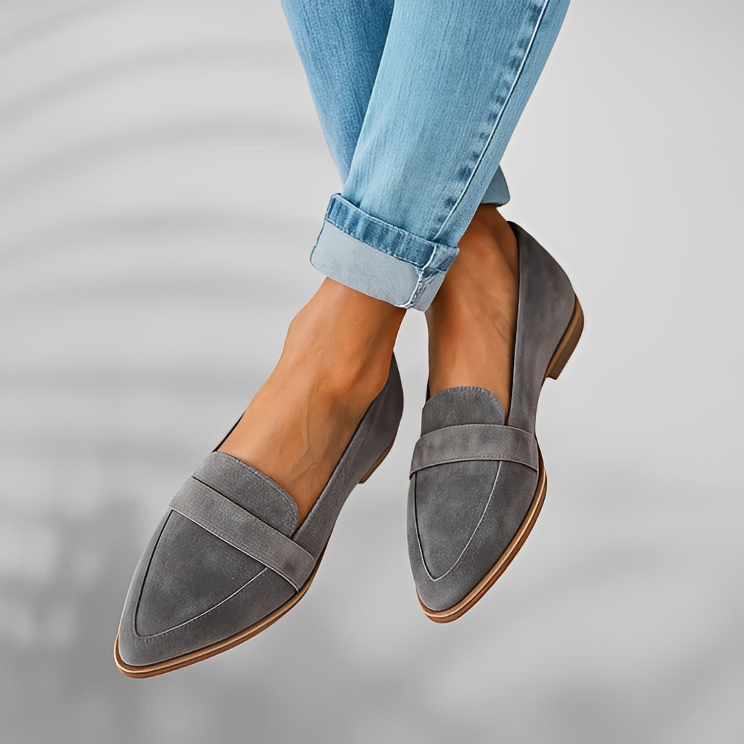 Grey suede pointed toe loafer displayed on white background