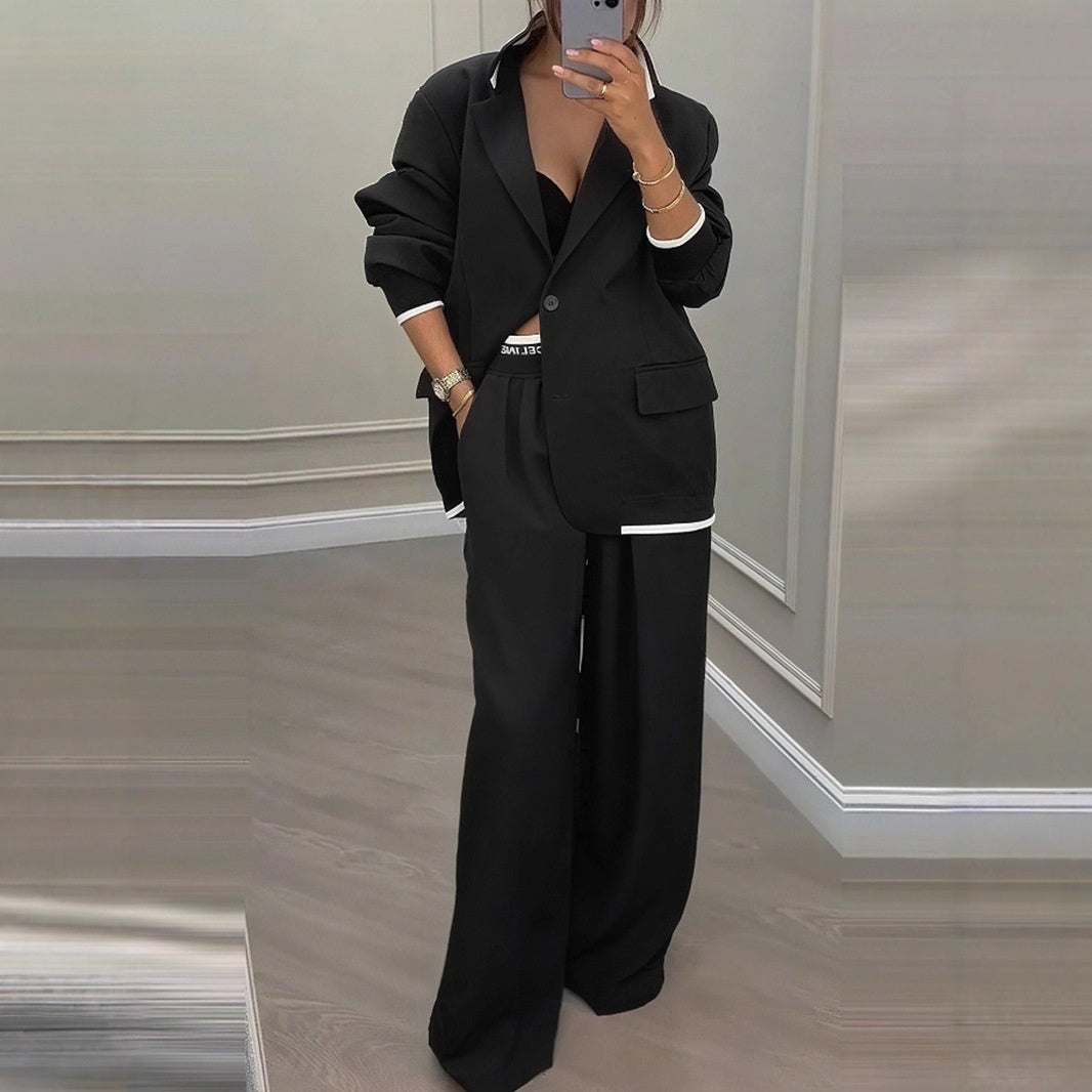 Model showcasing wide leg trousers fit and drape from side