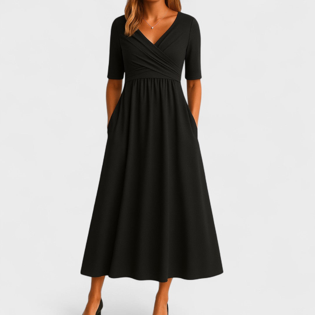 Model wearing wrap bodice dress, full-length standing pose
